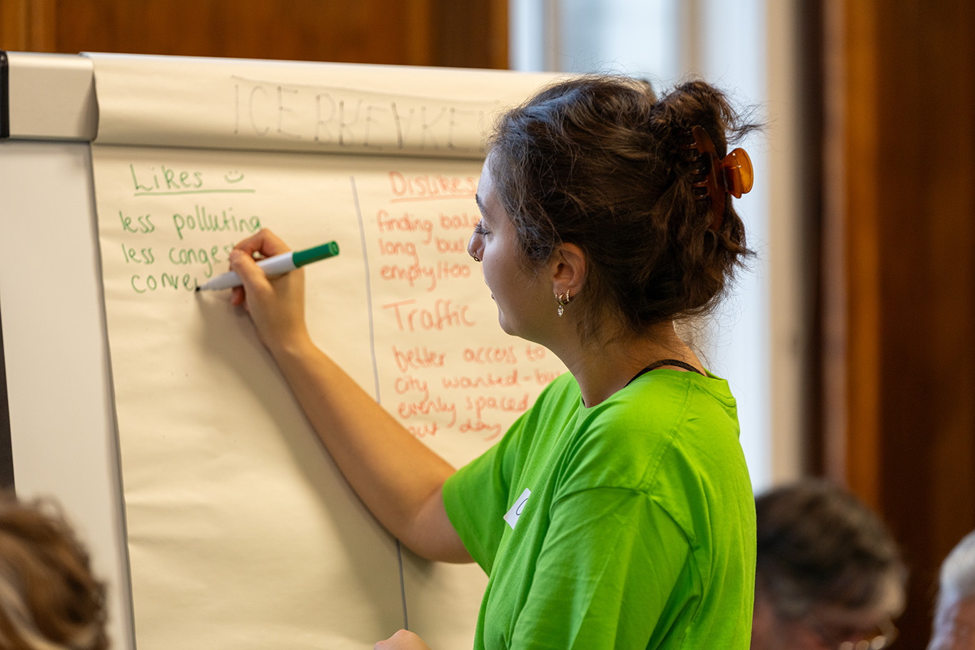 Image of a facilitator writing on a whiteboard